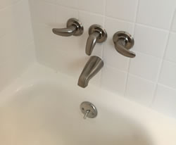 Attractive new three handle tub and shower valve. 